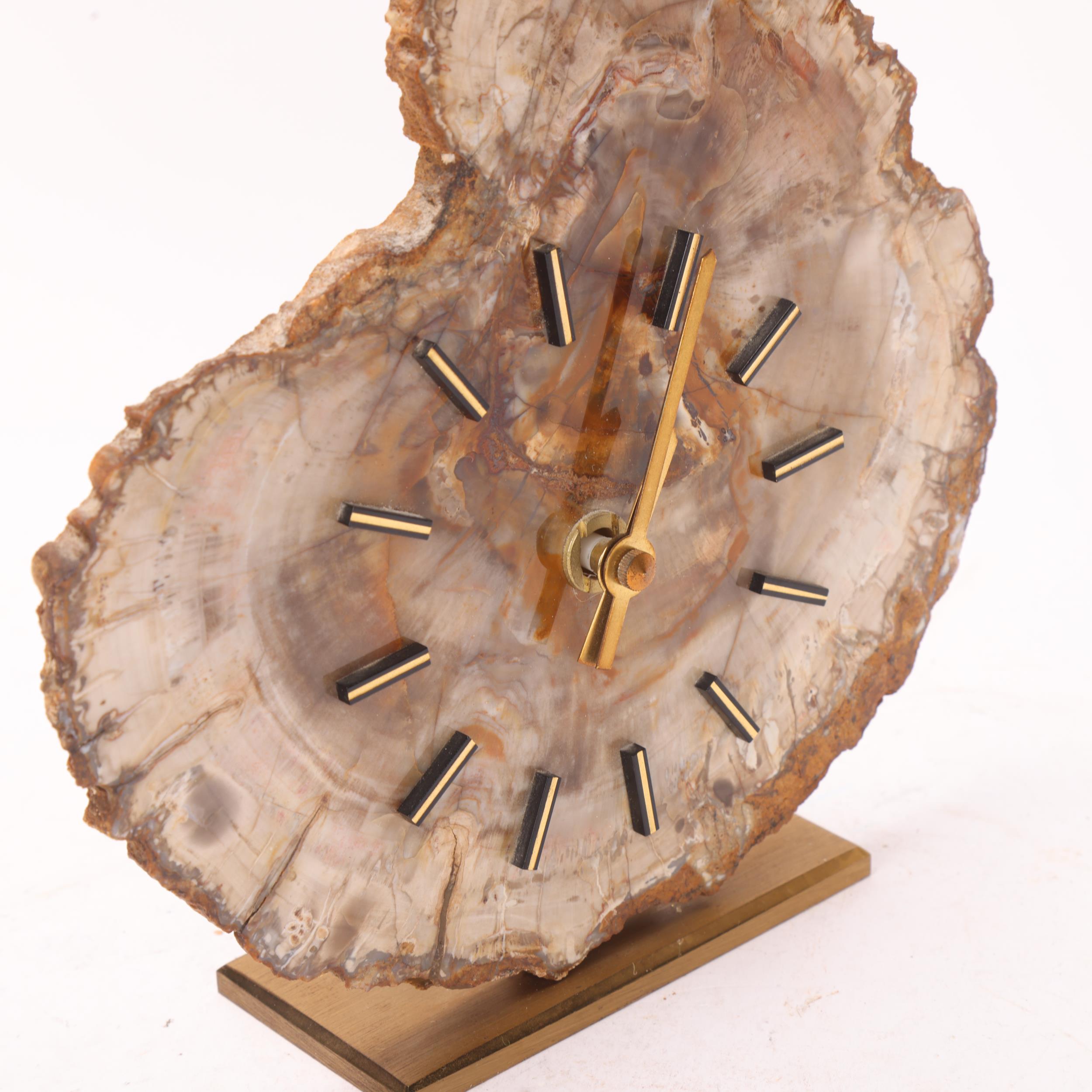 A mid 20th century quartz clock, with a fossilised wood face on brass stand, no makers mark, - Image 3 of 3