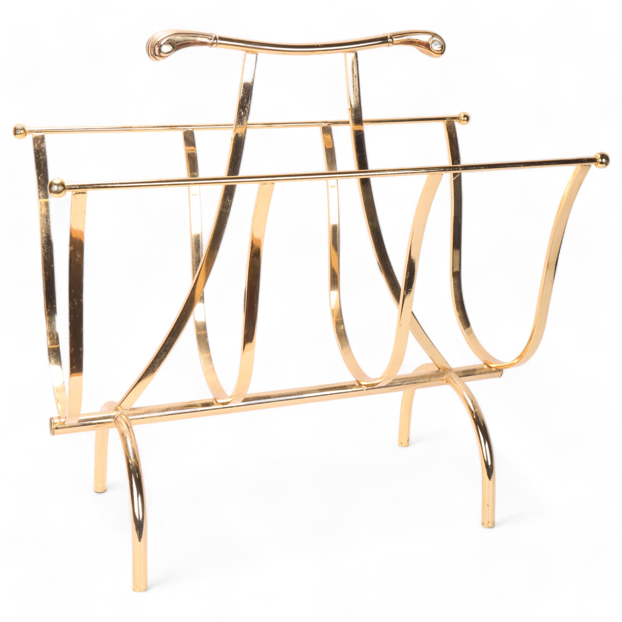 A vintage Hollywood Regency style magazine rack, gilt metal with scrolled handles, height 50cm,