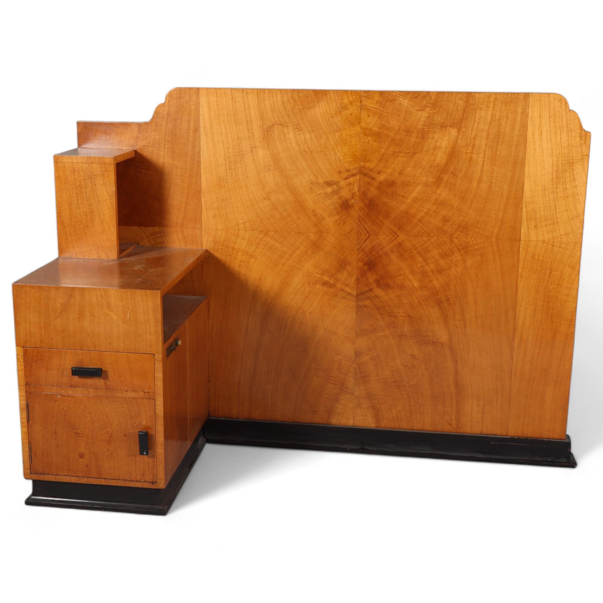 Art Deco walnut bedhead with integral bedside cupboard, width 145cm, height 107cm