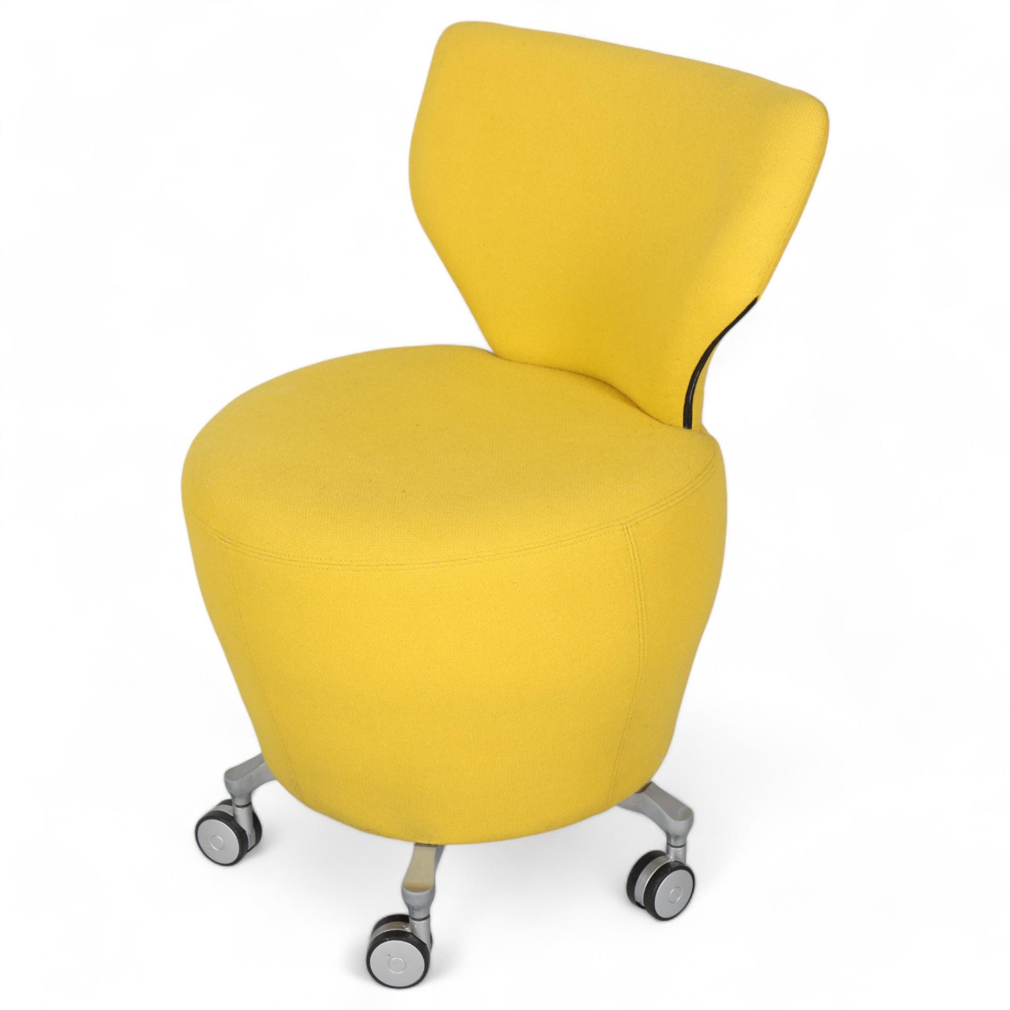 An Orangebox chair on casters, with yellow wool upholstery, makers marks to base , height 81cm