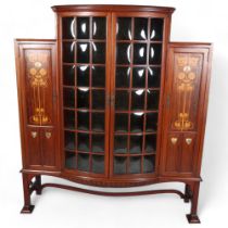 Shapland & Petter, an Art Nouveau mahogany display cabinet, 2 central doors with bow-glass panels