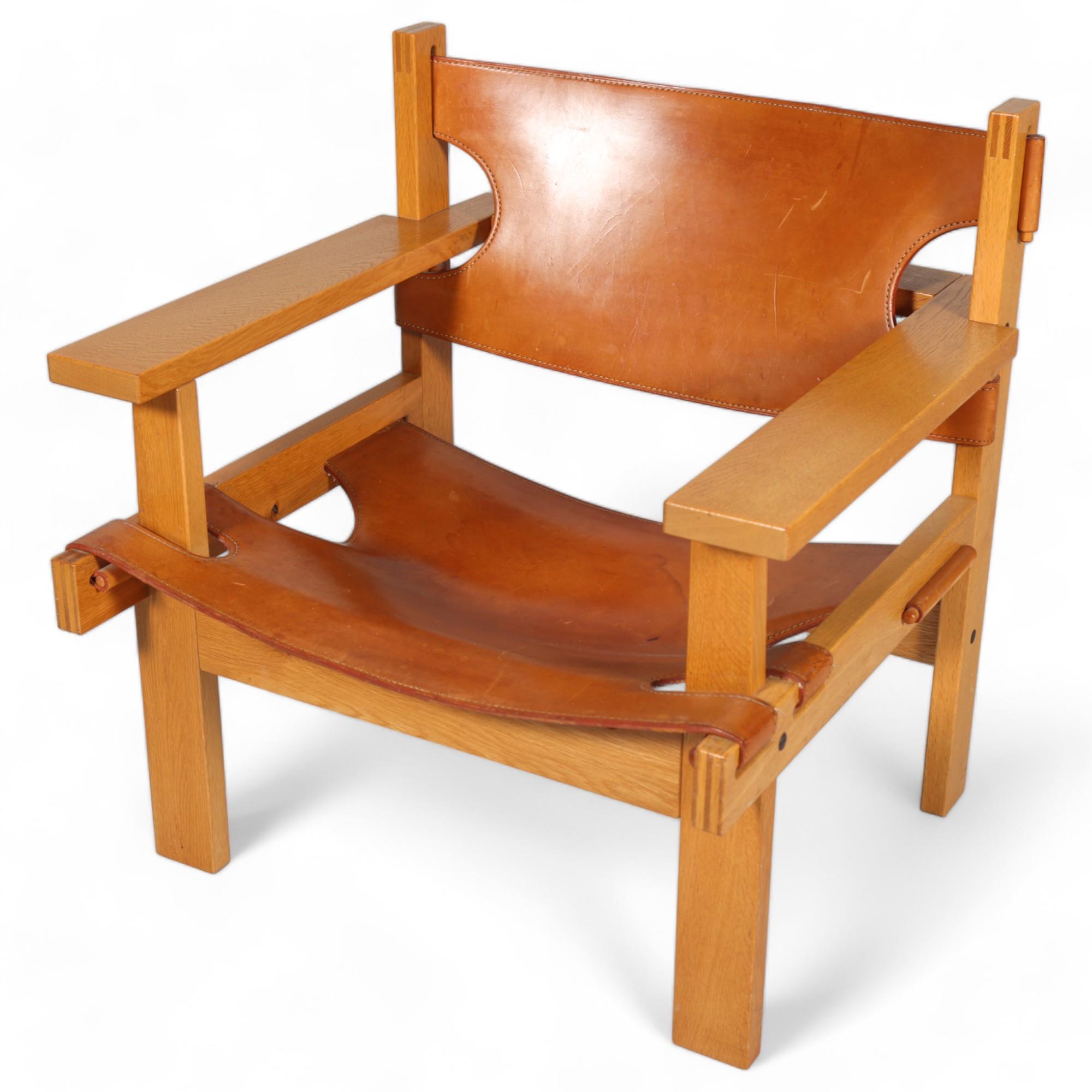 GUNNAR GUDMUNDSSON, a mid-century “Chief” safari style lounge chair in oak with saddle leather sling