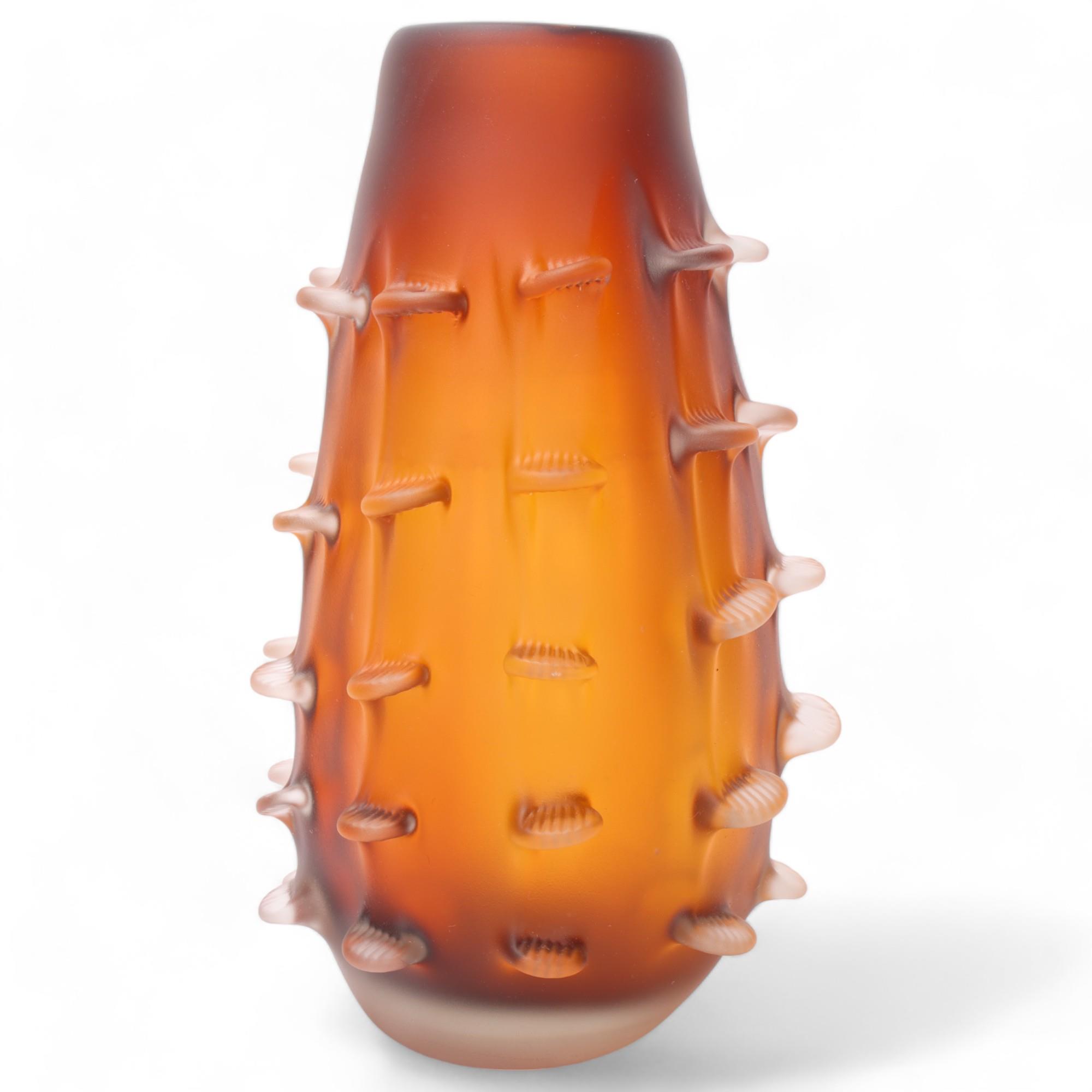 A heavy walled etched amber glass vase with pinched fin decoration, no makers marks, height 30cm
