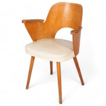 A mid 20th century Thonet desk chair, bent beech plywood frame with beech pin legs and beech