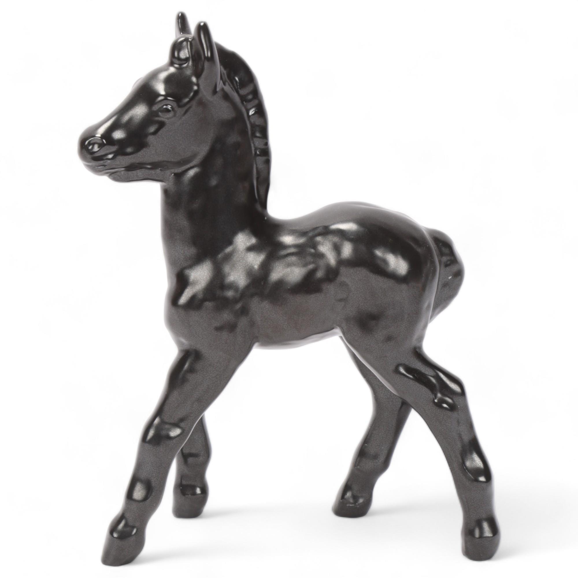 VICKE LINDSTRAND for Upsala Ekeby, Sweden, a figurine of a black foal, design nr 62 in the 1939