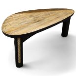 TERRY WARREN, an ebonised driftwood coffee table, with polished top and rope inserts to legs, signed