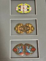 3 Art Nouveau coloured enamel buckles, mounted in good quality modern frame, overall frame
