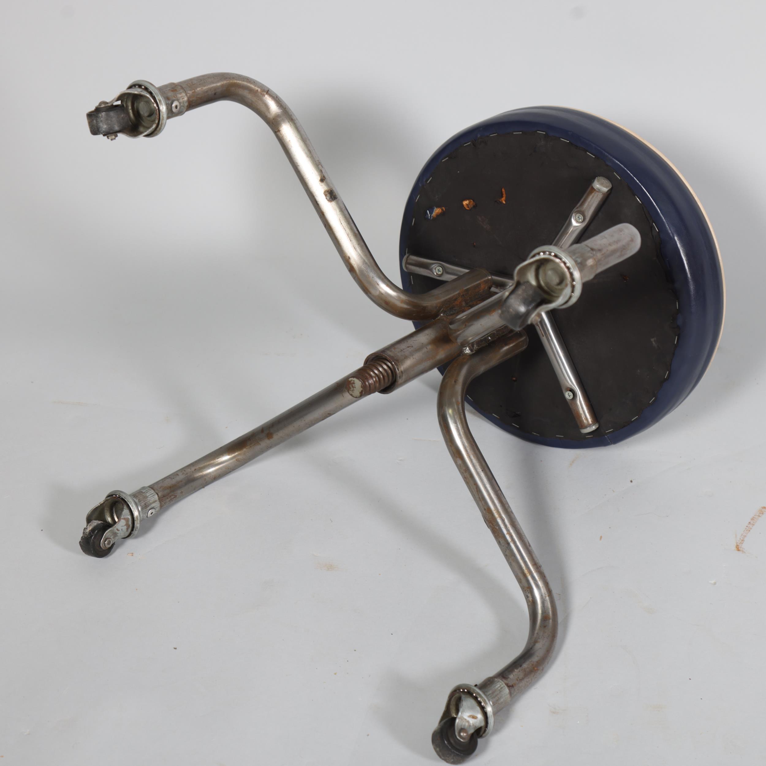 A mid-century modernist tubular steel industrial height adjustable stool with blue leather seat, - Image 2 of 3