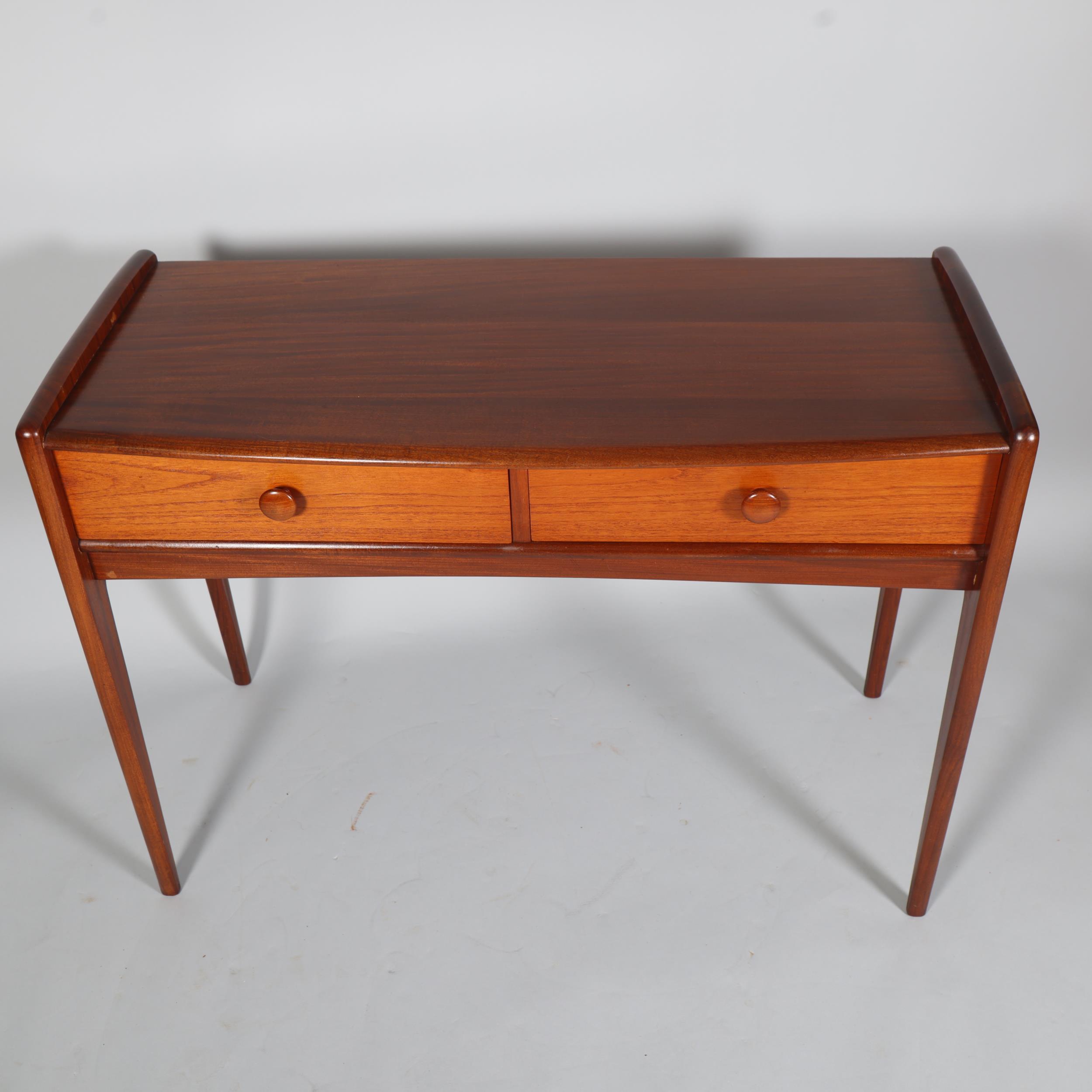 JOHN HERBERT for A Younger Ltd, a teak console table or desk with two drawers, makers label to - Image 2 of 6