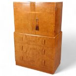 Art Deco birdseye maple tallboy, 2 doors above enclosing shelved interior with 3 long drawers