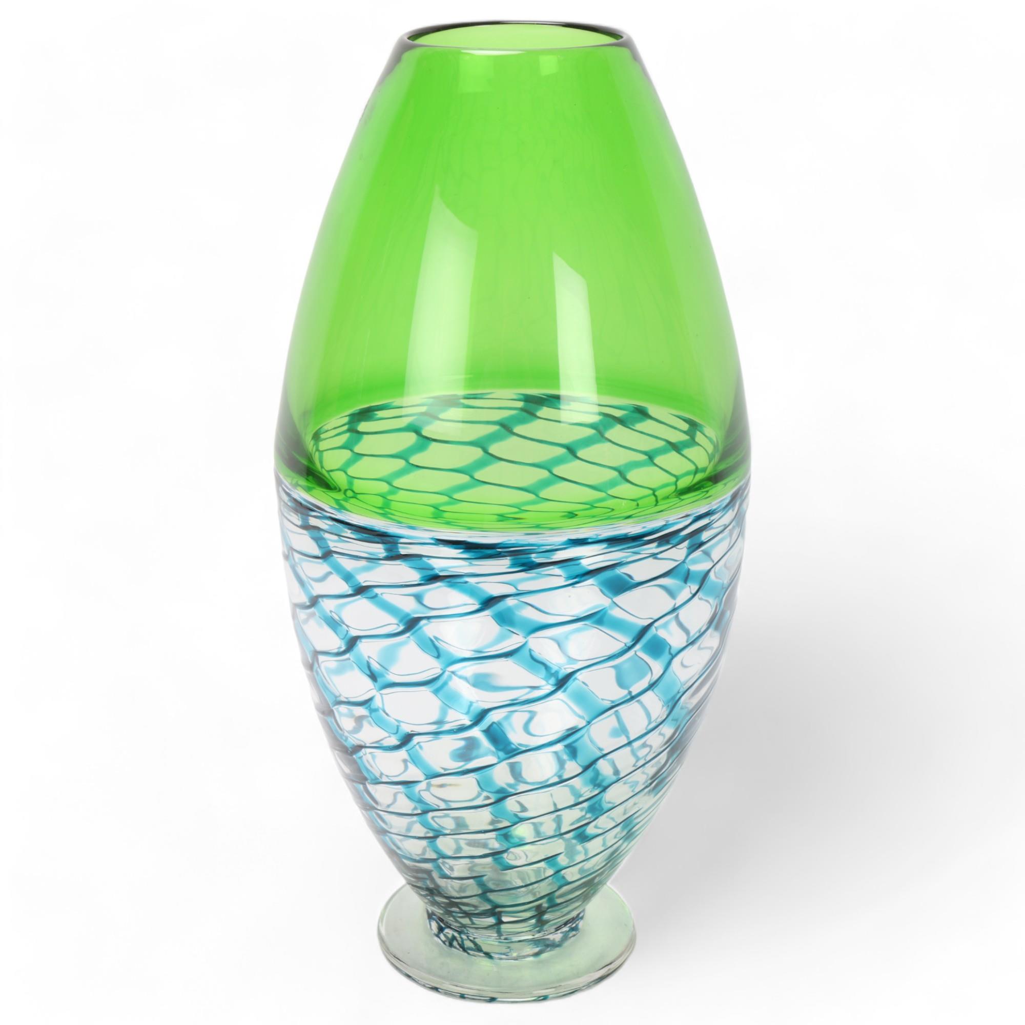 BOB CROOKS, a large footed studio glass vase, with green and turquoise lattice work body, signed