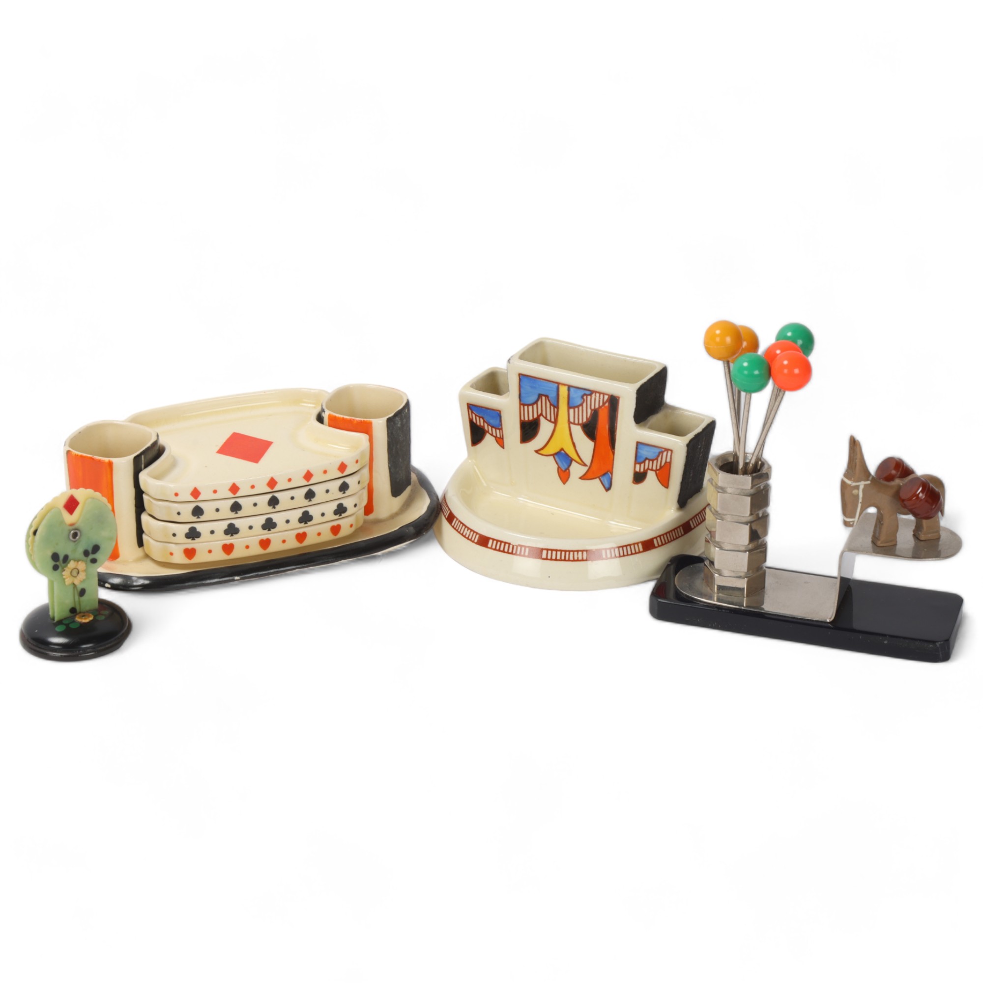 A group of Art Deco novelty items, comprising Royal Doulton Bridge set on stand, Bakelite Bridge