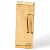 A Dunhill gold plated lighter, serial number 97966, in original box Very good condition