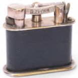A vintage Dunhill desk lighter, silver plate with leather cover, Reg No 737418, marked Dunhill
