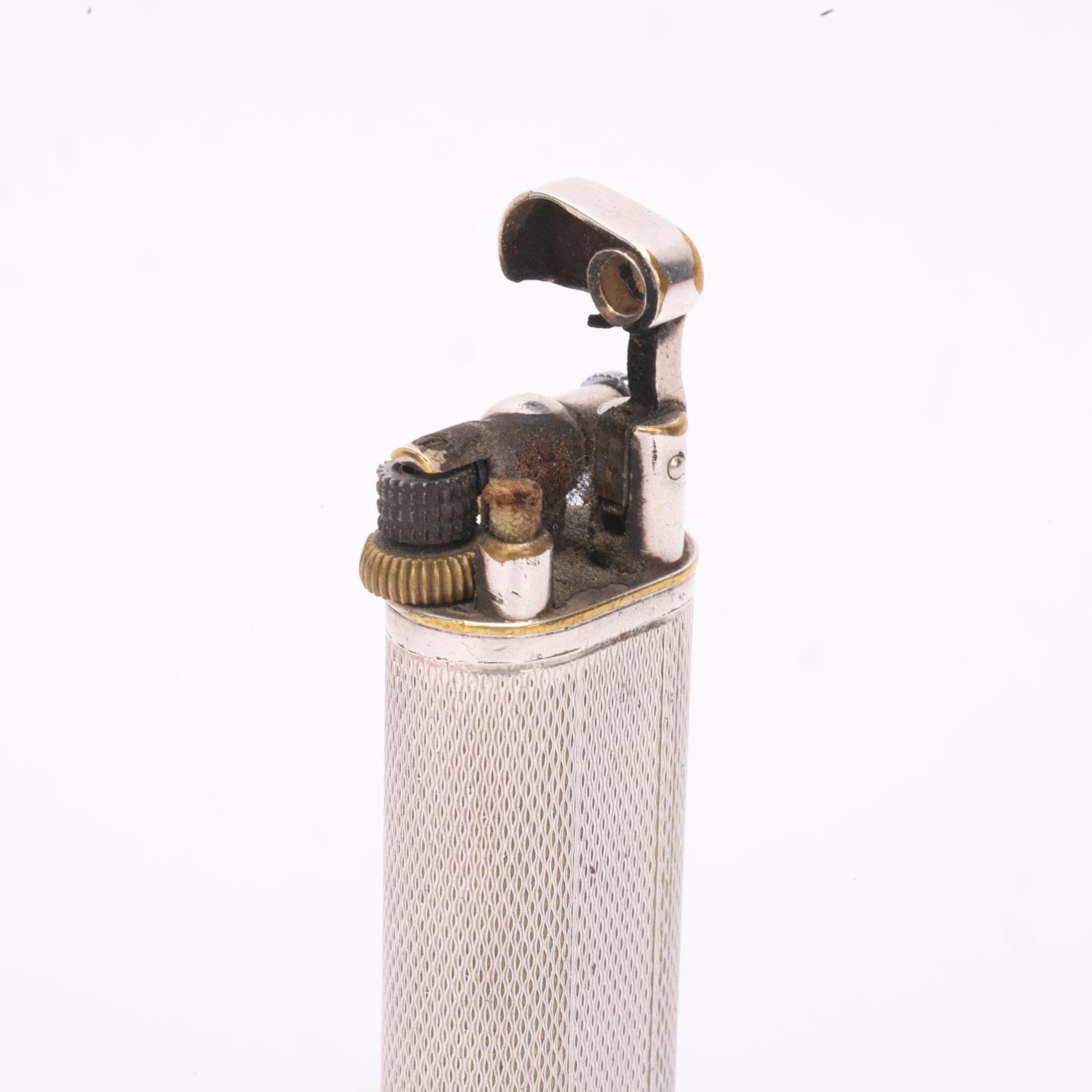 A vintage Dunhill silver plated lighter, slimline model with hammer arm, makers marks to base, - Bild 3 aus 4