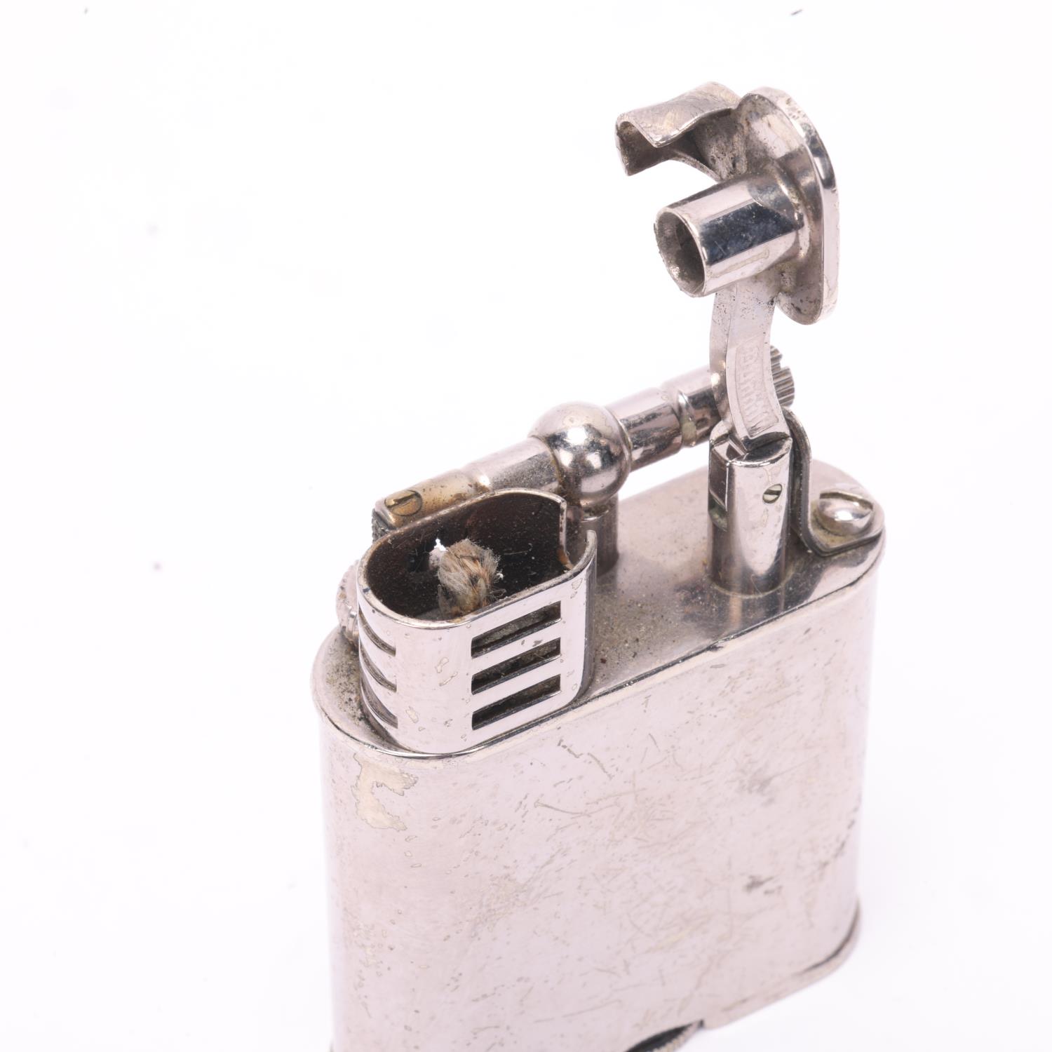 A vintage Dunhill silver plated lighter, makers marks to base, height 5.5cm A number of small - Bild 4 aus 4
