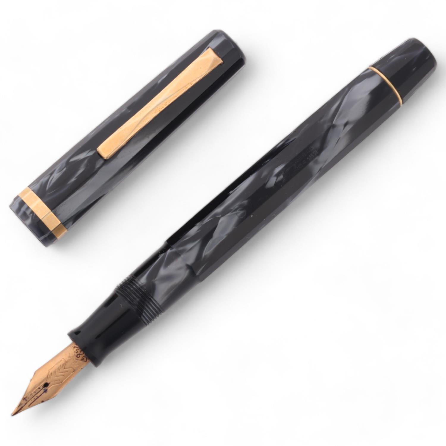 An Omas Dama fountain pen, with 14ct nib and black marbled resin, marked "EXTRA 445846