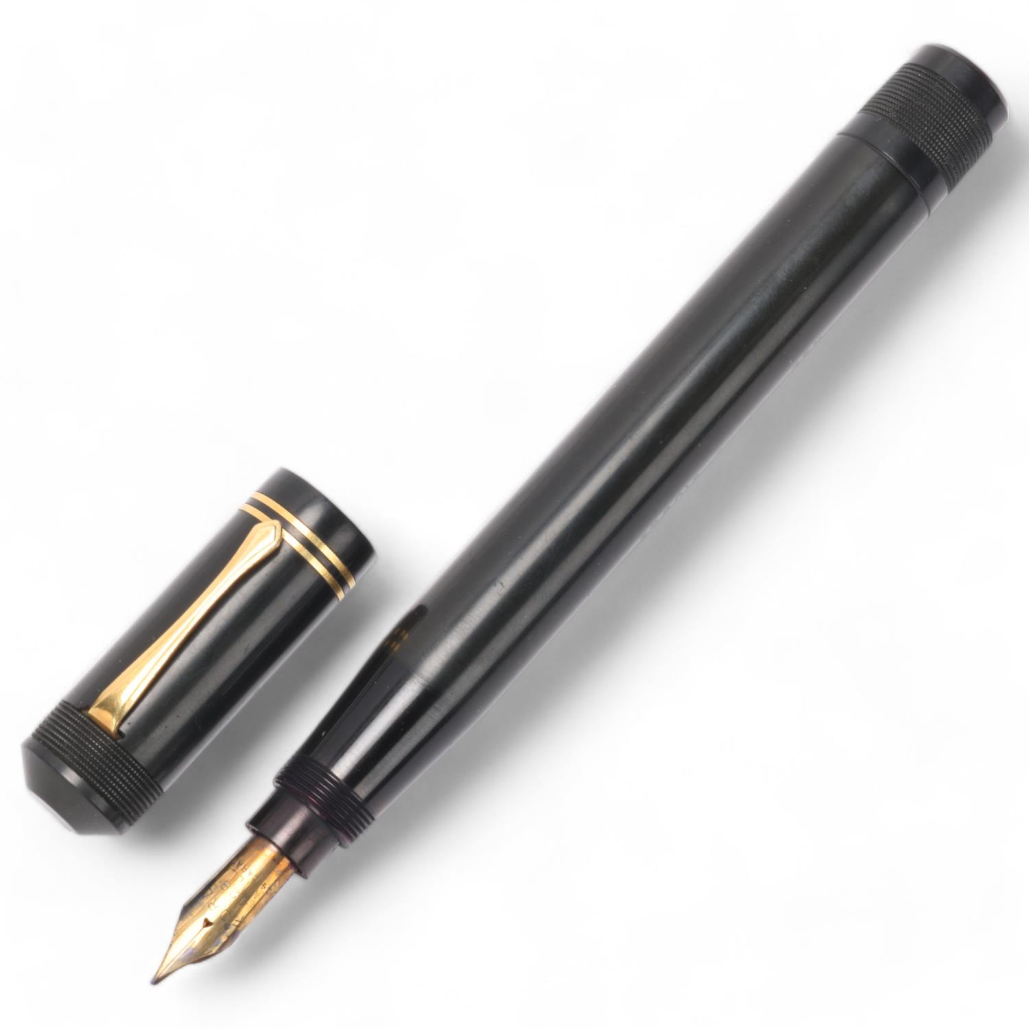 A Ford's Patent fountain pen, circa 1930, black rubber body, nib marked 428 Mill, 14ct, length 16 cm
