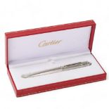 A Cartier "Diablo de Cartier" ballpoint pen, with engine turned steel body, original box and papers