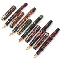 5 vintage Parker fountain pens, with marbled resin bodies lever and sprung pump "Vacumatic" fill,