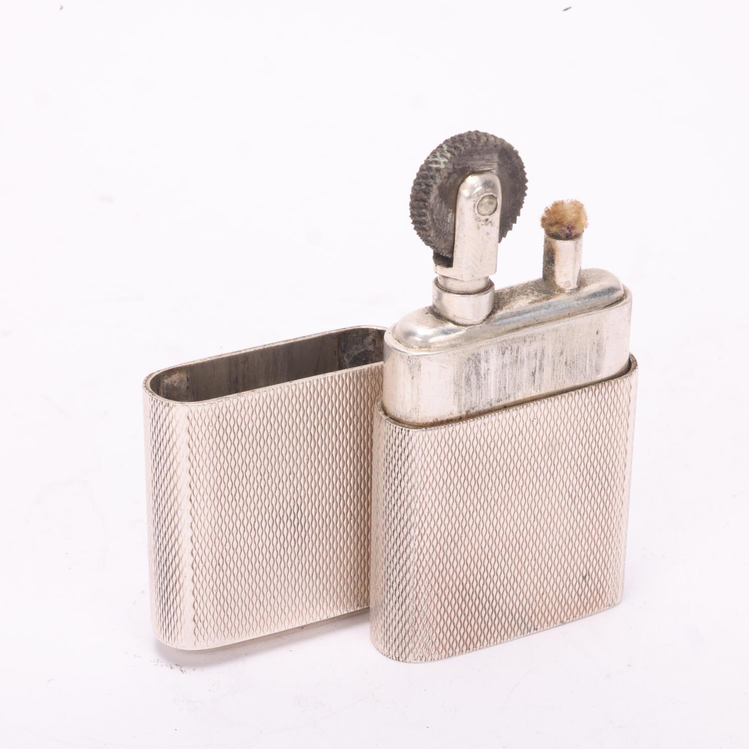 A 1946 hallmarked silver "The Howitt Lighter", engine turned body with initials GRC on cap, Untested - Image 4 of 4