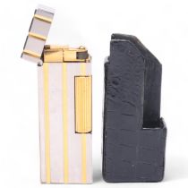 A vintage Dunhill Rollagas silver and gold plated lighter, in Dunhill leather slip-case, makers
