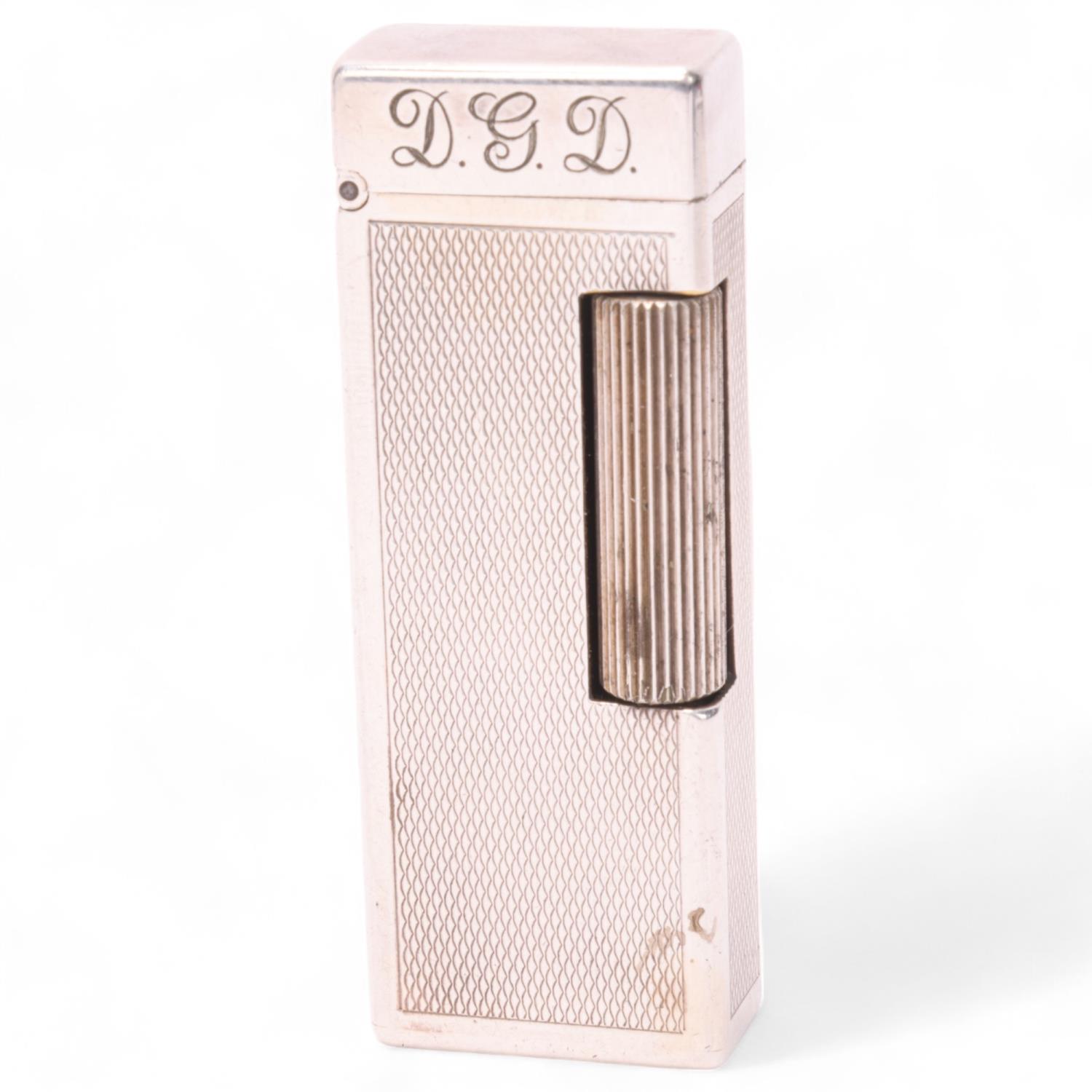 A vintage Dunhill silver plated Rollagas lighter, with unusual automatic flip-top mechanism,