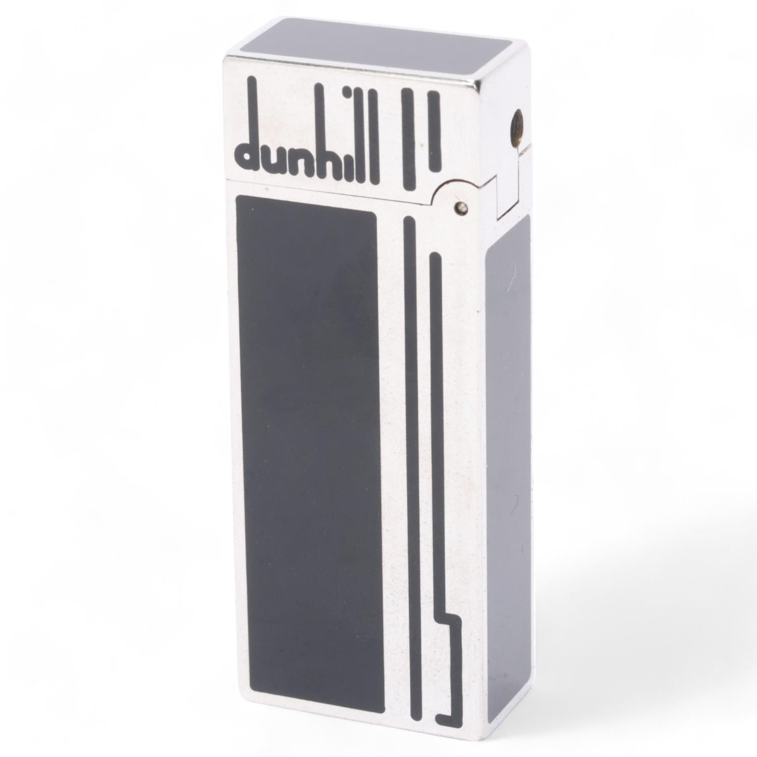 **WITHDRAWN** A vintage Dunhill silver plated Rollagas lighter, with black lacquer detail