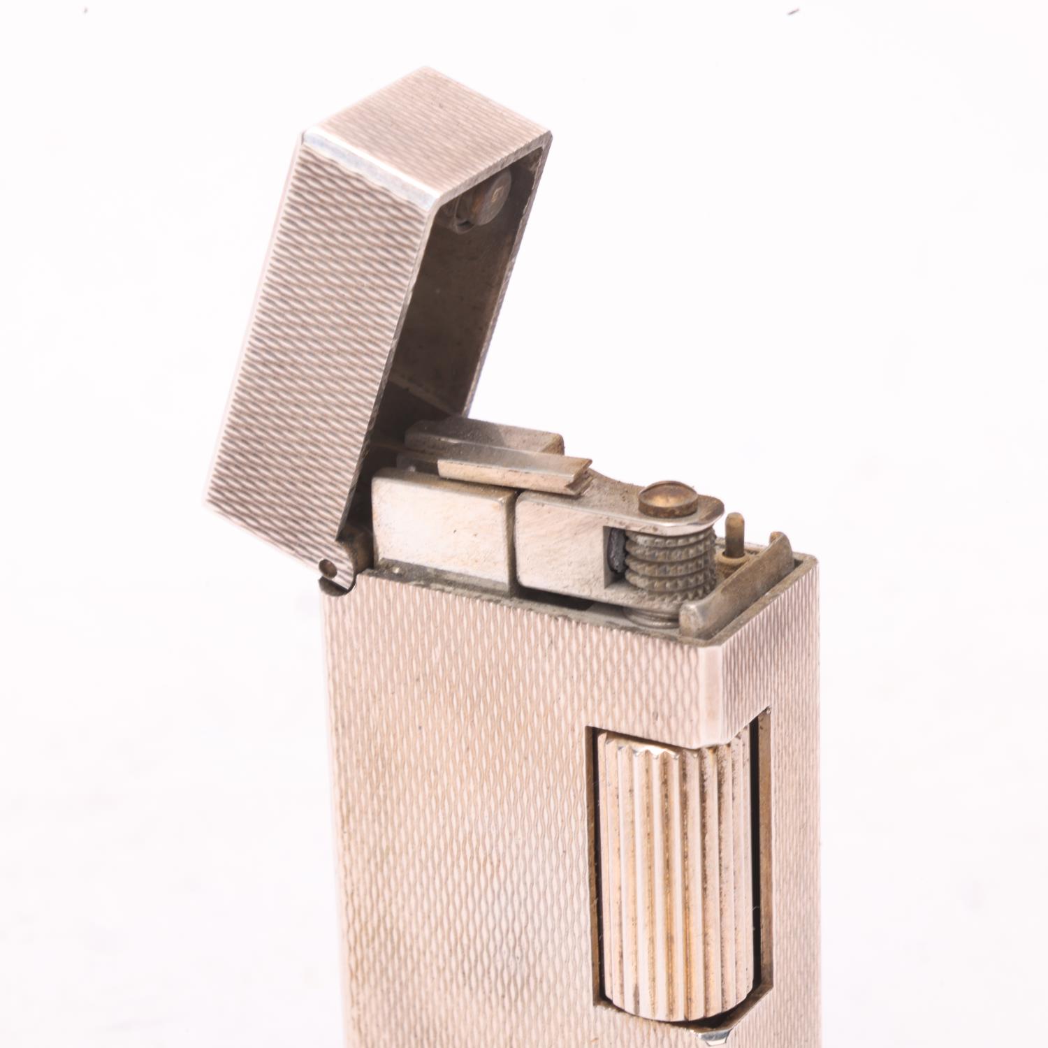 A vintage Dunhill silver plated Rollagas lighter, engine tuned body, makers marks to base No - Image 3 of 4