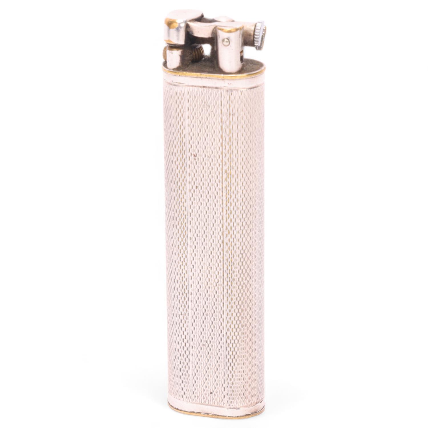 A vintage Dunhill silver plated lighter, slimline model with hammer arm, makers marks to base,