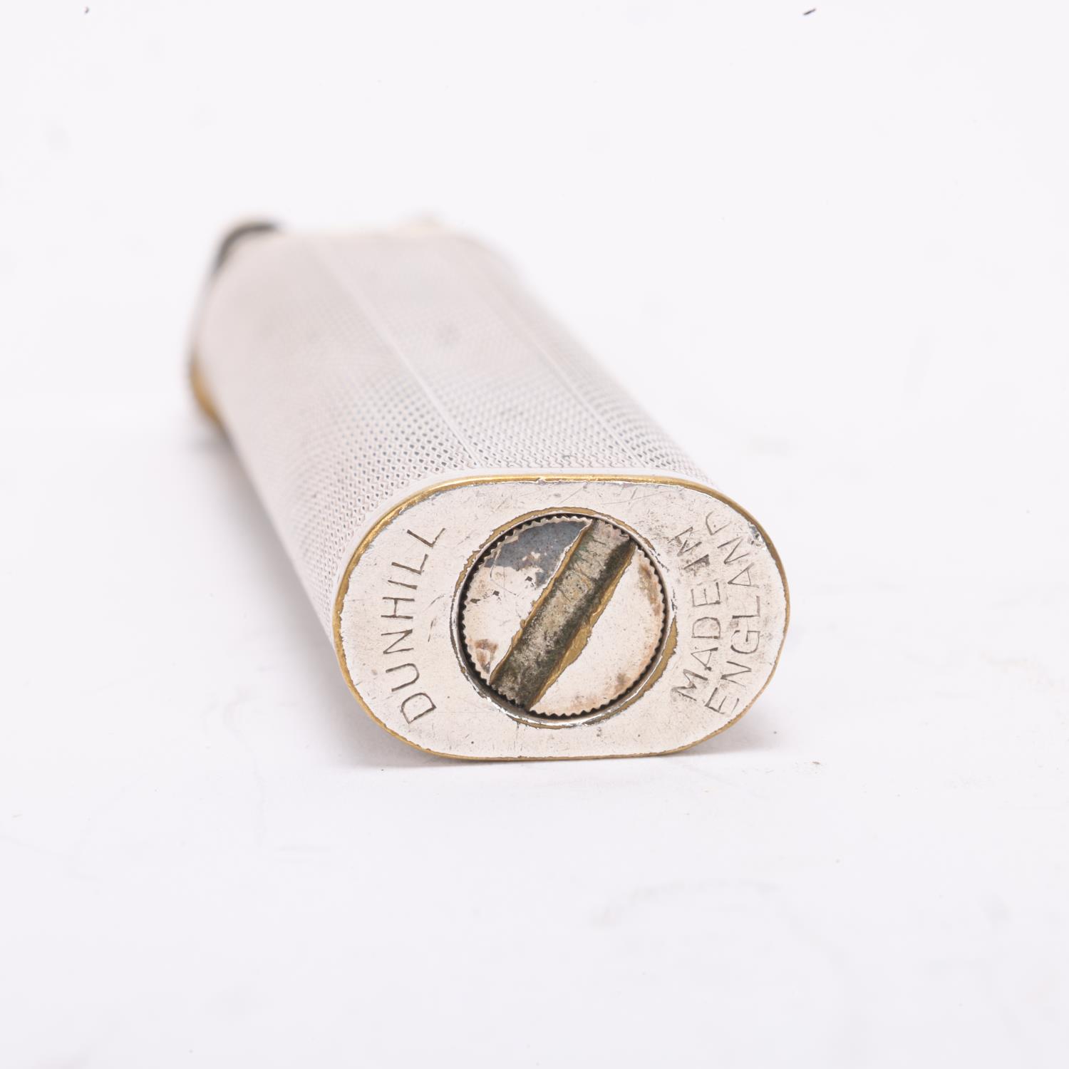 A vintage Dunhill silver plated lighter, slimline model with hammer arm, makers marks to base, - Bild 4 aus 4