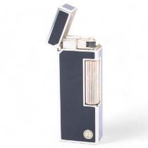 A vintage Dunhill Rollagas lighter, silver plated with black lacquer panels, makers marks to base