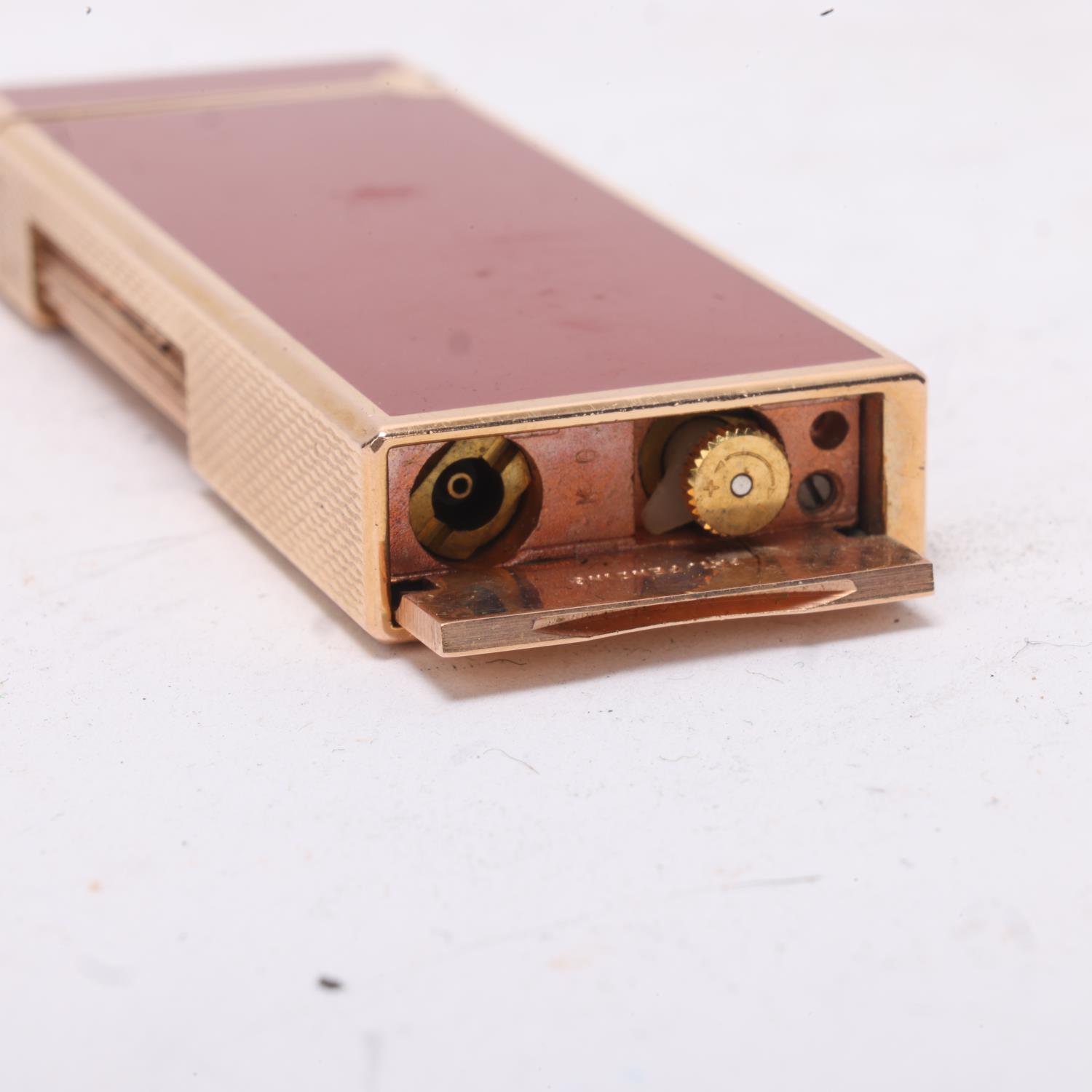 A Dunhill slimline Rollagas lighter, gold plated with red lacquer body, makers marks to base, - Image 4 of 4