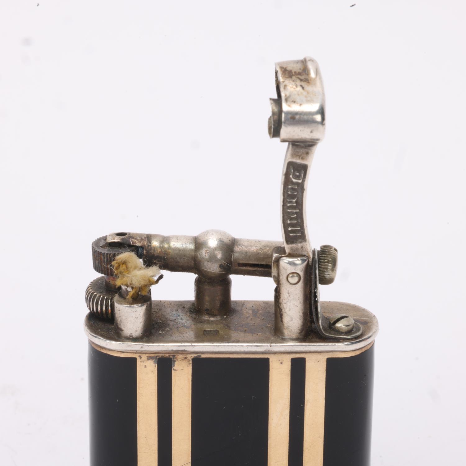 A 1929 hallmarked silver Dunhill lighter, with gilt and black lacquer body, gilt metal crown detail, - Image 2 of 4