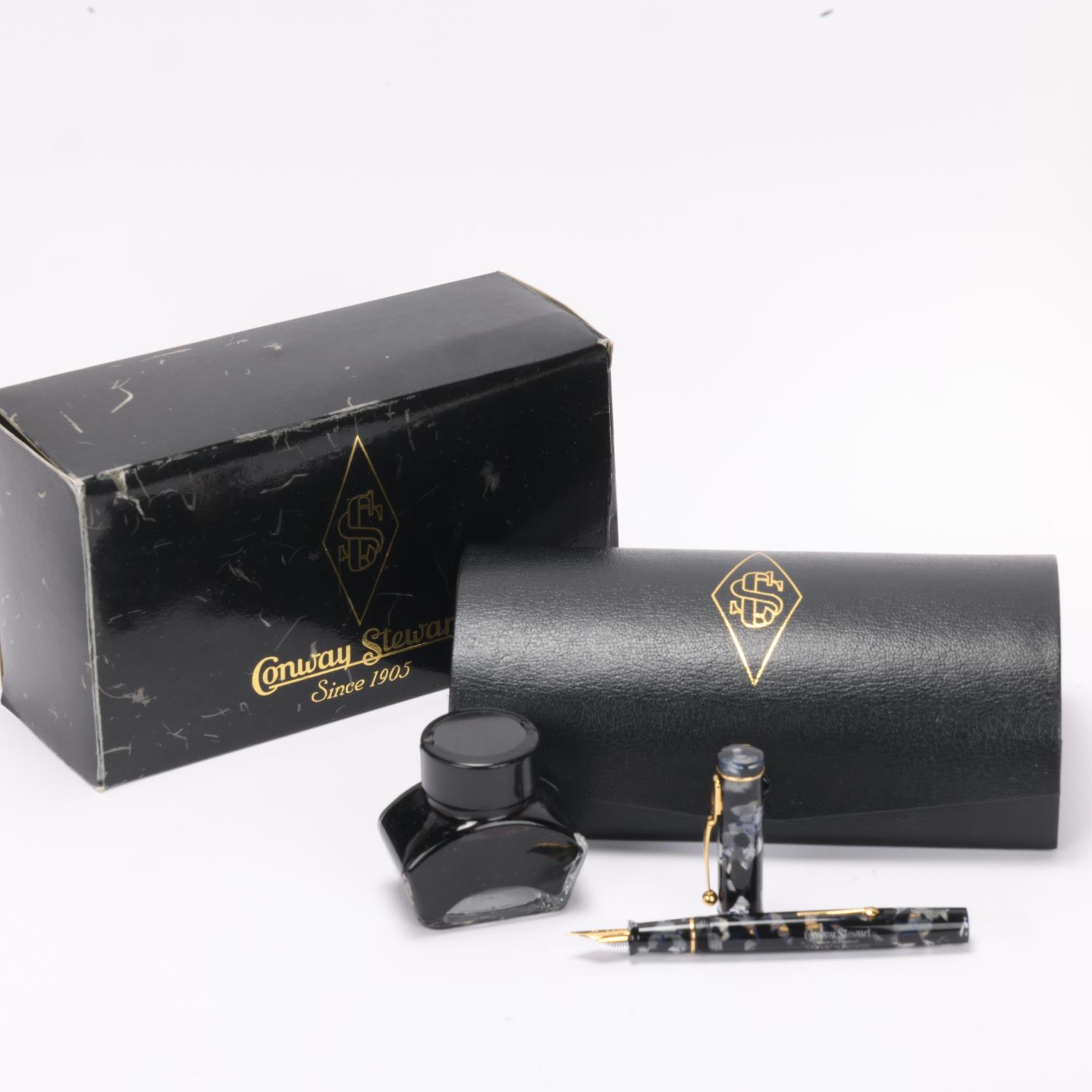 A limited edition Conway Stewart "Dandy" lever fill fountain pen, black and clear marble resin body, - Image 4 of 4