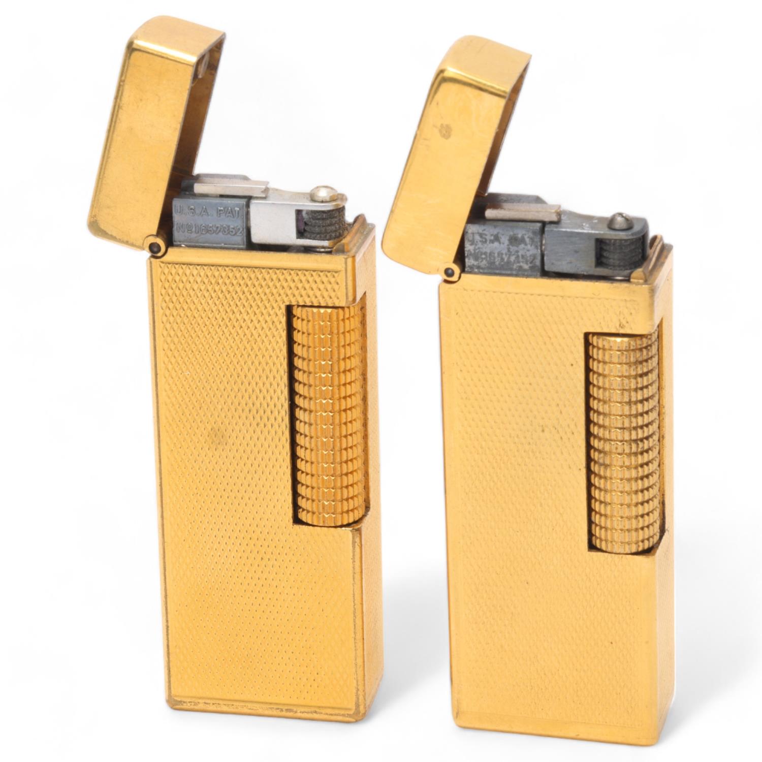 2 vintage Dunhill gold plated Rollagas lighters, with engine turned bodies, mechanism USA Pat No