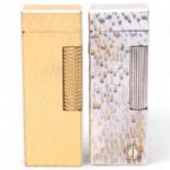 2 vintage Dunhill Rollagas lighters, both with textured silver and gold plated bodies, makers