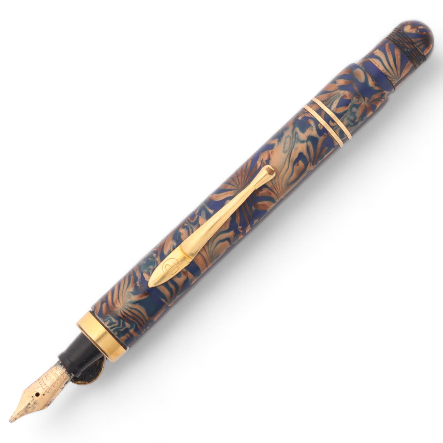 A Pullman blue and gilt marbled fountain pen with 14k nib and gilt mounts, with push action pop up