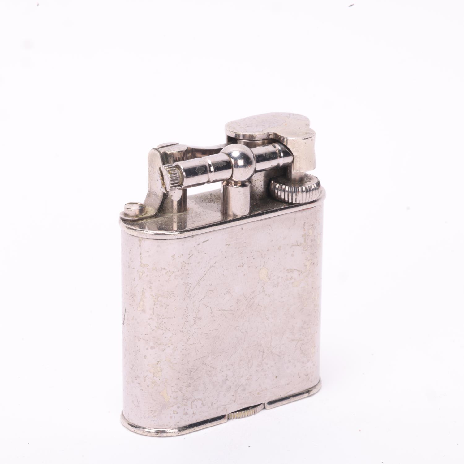 A vintage Dunhill silver plated lighter, makers marks to base, height 5.5cm A number of small - Bild 2 aus 4