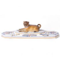 Meissen, a 19th century porcelain Pug dog paperweight, on stepped base, with a blue and gilt collar,