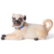 Meissen, a porcelain figure of a seated Pug, with blue and gilded studded collar, L7.7cm, with