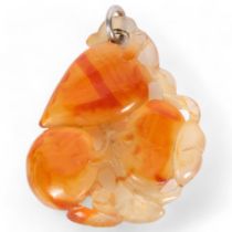 A Chinese carved carnelian agate fruit pendant, L5.5cm