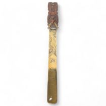 A Japanese engraved and embossed brass page turner/letter opener, 31cm