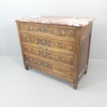 A French 18th century oak chest of four long drawers, with rouge marble top, brass pulls and