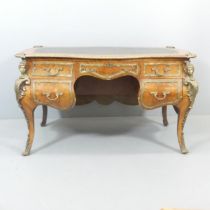 An antique French Louis XV style kingwood kneehole centre-standing bombe writing desk, with brass