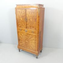 A late 19th Century French kingwood marquetry inlaid and marble topped cabinet, with brass mounts,