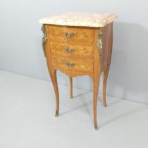 A French kingwood and marquetry inlaid marble topped bedside chest of three drawers, brass mounts