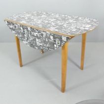 JACQUELINE GROAG - a mid-century Manhattan pattern Warerite formica topped drop leaf dining table,