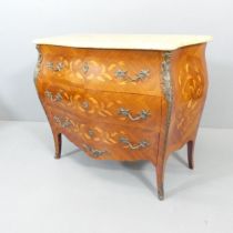A French Louis XV style kingwood veneered and satinwood strung bombe commode chest of three drawers,