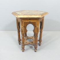 A Syrian hardwood hexagonal occasional table, with inlaid mother-of-pearl, bone and specimen